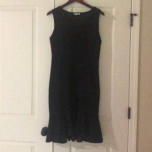 Fitted black polka dot dress.